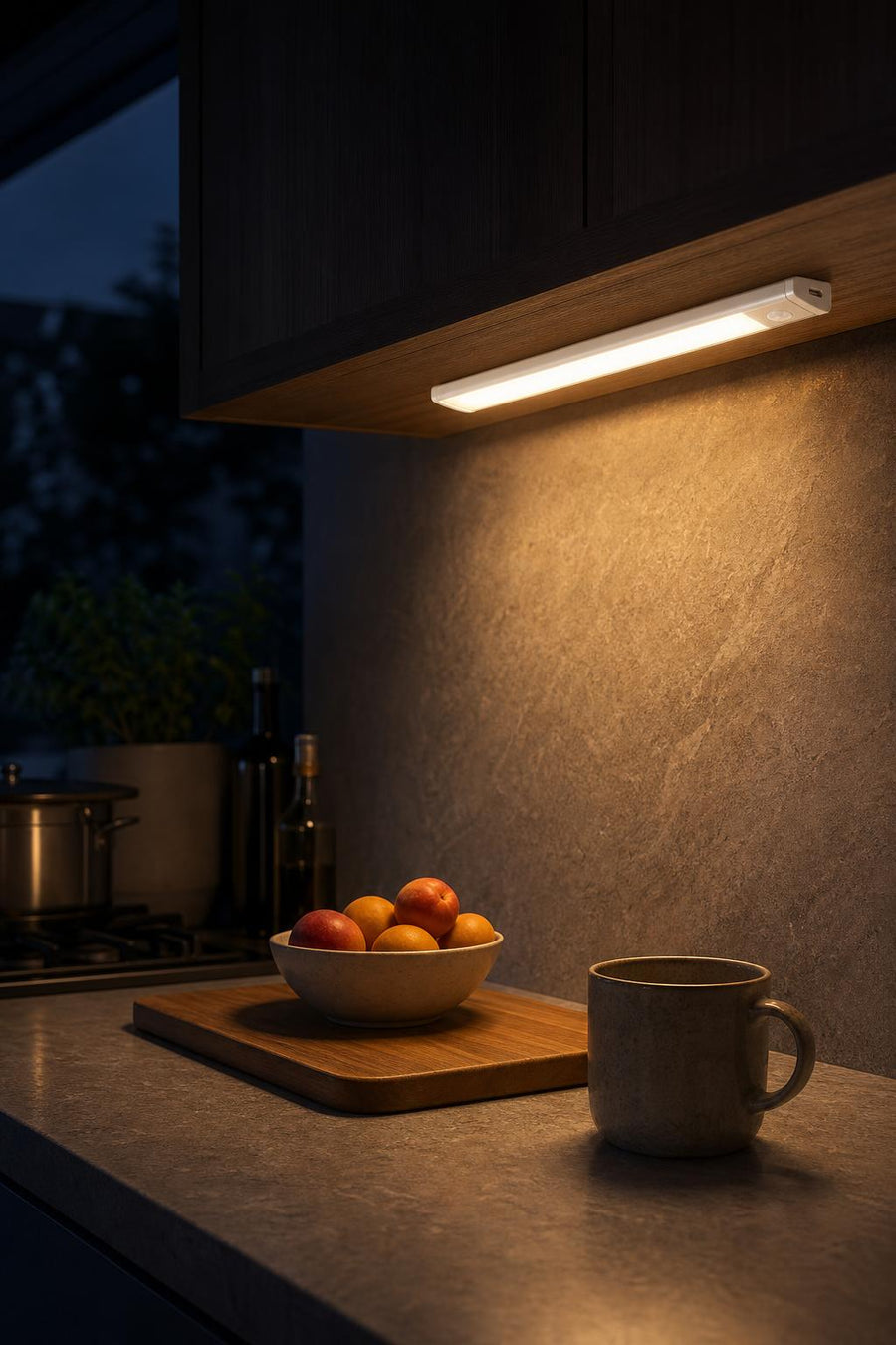 LED light bar under a kitchen cabinet at night
